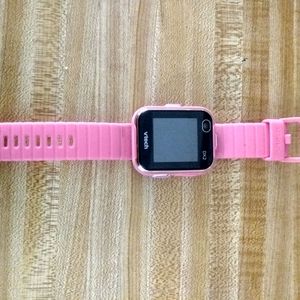 V-tech smart watch with USB cord.